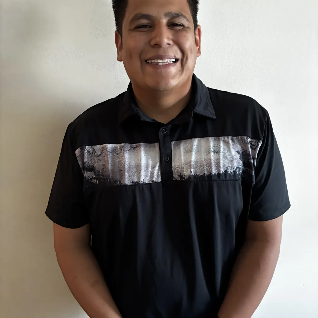 person smiling wearing a black collared shirt