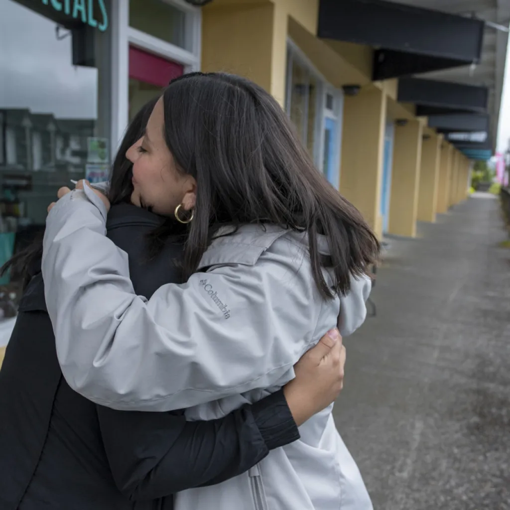 two people hugging. one is youth 