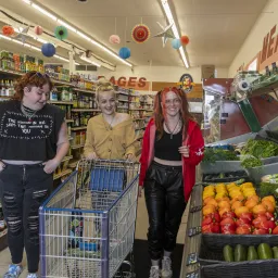 Young people shopping in grocery store