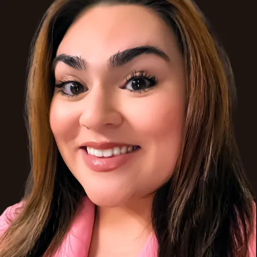 person with long hair smiling